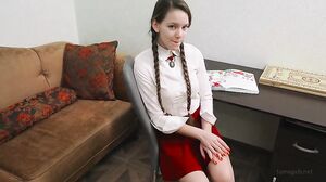 Nika In A Red Skirt And White Shirt Is Playing With Her Fingers On A Table's Cam show and profile